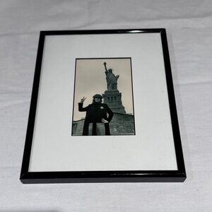 John Lennon giving the peace sign at Statue of Liberty New York. Beatles.